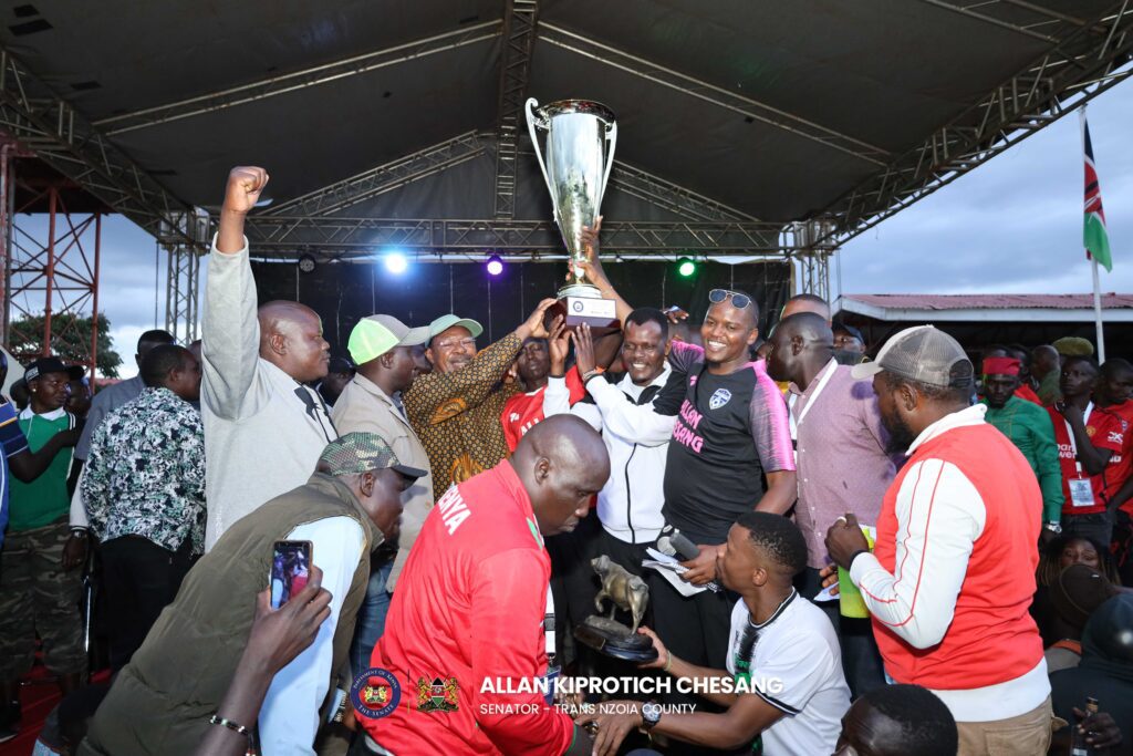 Speaker of the Nation Assembly holding the trophy.